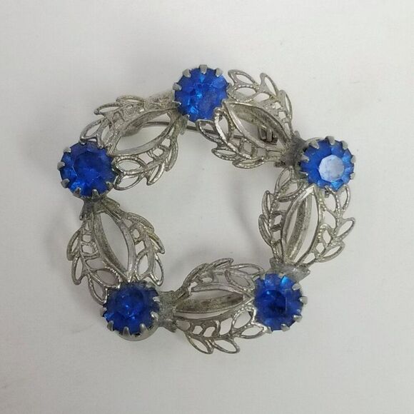 Vintage Blue Rhinestone and Silver Tone Filigree Circle Brooch, Prong Set Estate - Picture 1 of 6